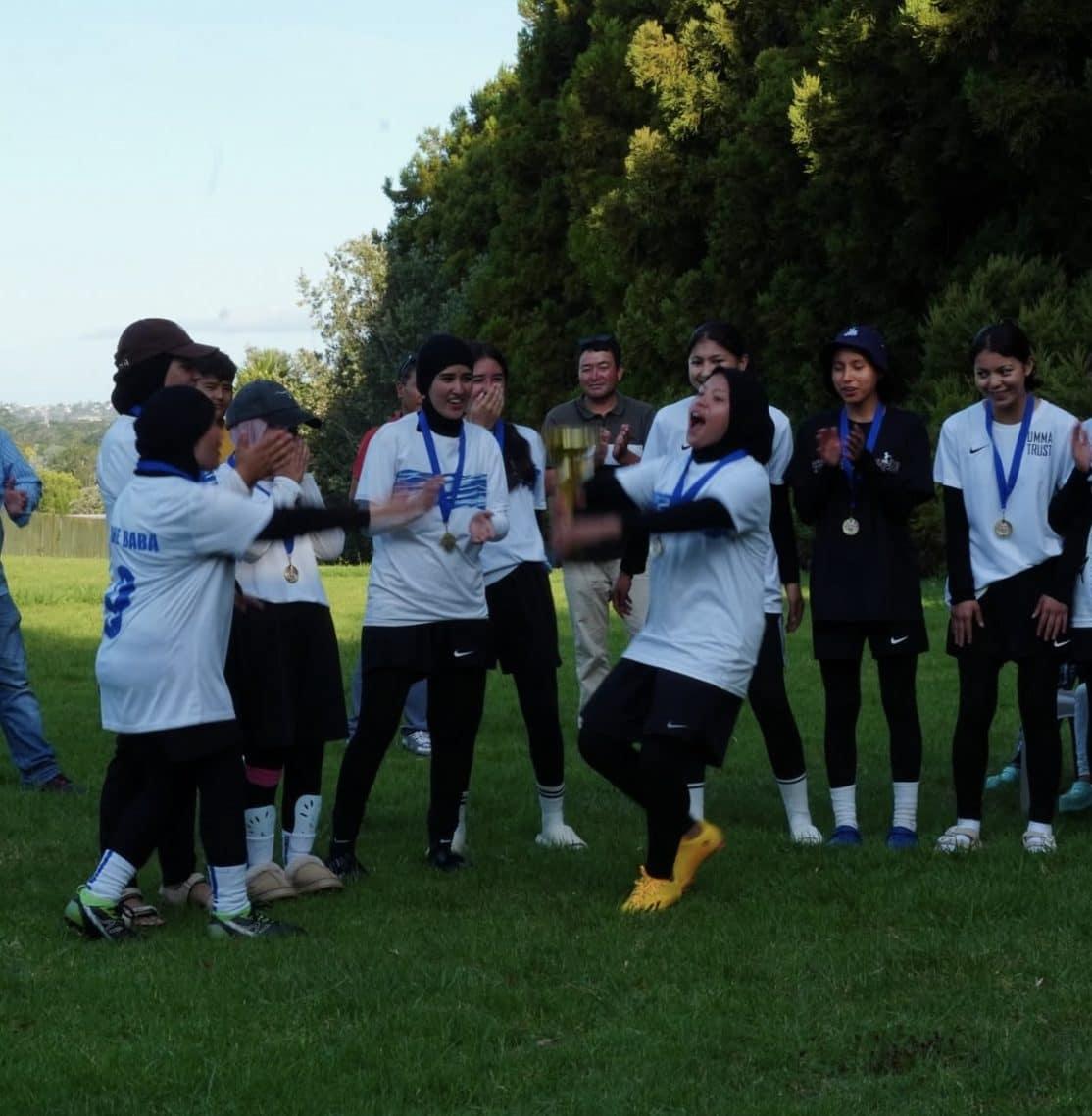 Celebrating with the girls team